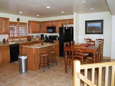 Kitchen and dining area overlooks great room
