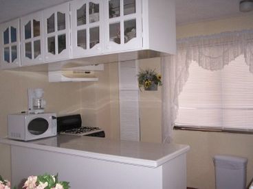 Full kitchen, with many extras- refrigerator, stove, oven, microwave, coffee maker, toaster, and all utensils.