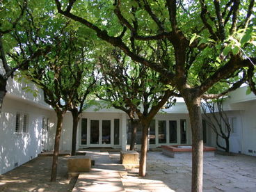 Beyond the courtyard and the massive sandstone stepping blocks is an oversized reception foyer and art gallery 40 feet long.