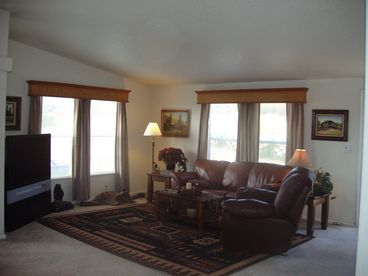 Living room, very comfortable leather sofa and recliner. Along with a big screen HDTV.
