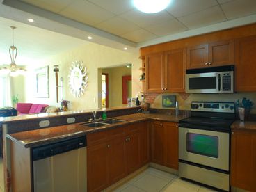 Full Amenity Kitchen with Stainless Steel Appliances and Granite Kitchen Top, as well as, custom mural paint work