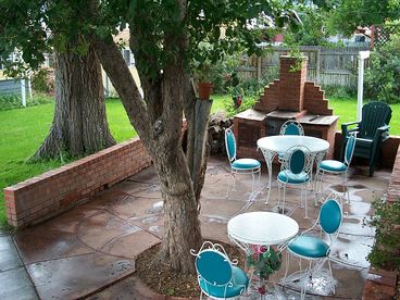SHADY PATIO WITH WROUGHT IRON SEATING, A LARGE YARD FOR CROQUET AND A GAS GRILL FOR BARBEQUES.TOWN BIKES FOR YOUR USE ARE IN THE DETACHED GARAGE.