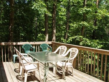 Lounge or dine on our deck as you are surrounded by forest.