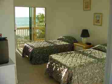 One of two twin bedrooms.  Direct access to the deck from the bedroom. Usually set up for children with TV/VCR combo in the room