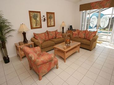 The spacious Family Room, overlooking the pool deck.  Has large TV, Video, DVD and Sound System.