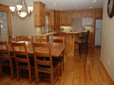 Large fully-equipped kitchen with filtered water/ice in the fridge and seating for up to 12 people.