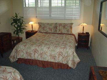 Bedroom with a queen size and twin bed. Enjoy a ceiling fan and cable TV
