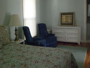 King Bed - Chairs and dresser + custom cabinet and dresser for more storage.