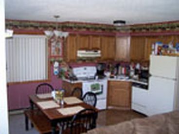 Fully stocked eat-in Kitchen.