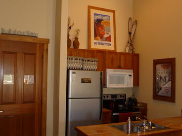 Kitchen is ready for any meal in this large one bedroom with two full baths that sleeps 6.  Great views and great rates.