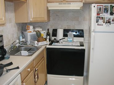 FULLY EQUIPPED KITCHEN WITH DISH WASHER AND GARBAGE DISPOSAL.