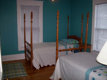 Large bedroom with two single beds