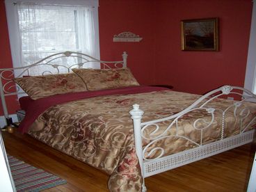 Lovely wrought iron full size bed in third bedroom