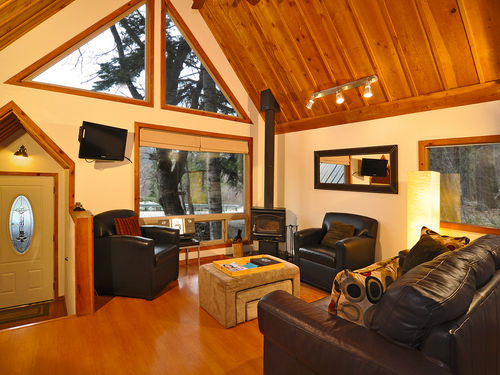 Great mountain and partial lake views can be enjoyed from the living area with gable windows