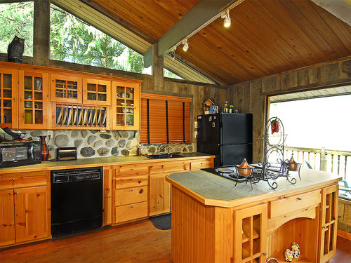 Fully equipped kitchen offers amazing river views.
