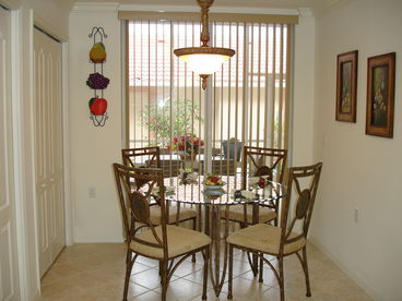 Sunny breakfast nook with sliding door to attached private Veranda. Large pantry.