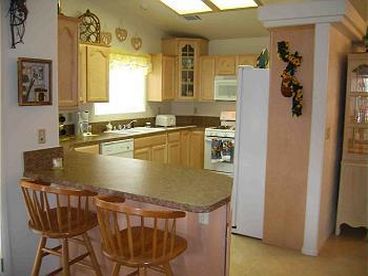 Breakfast bar, dishwasher, garbage disposal, microwave, double wide ref. with all cooking utensils needed.