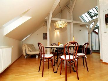 Living room with mosaic table and atelier windows