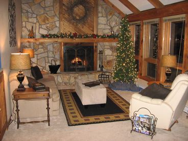 Living Room with Lots of windows facing the Large Front Deck, Golf Course and Mountains.