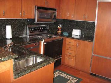 Fully equipped kitchen with granite counter tops