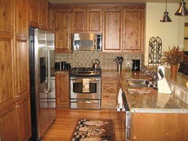 Fully equipped kitchen with granite counter tops