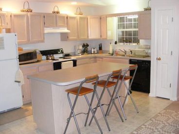 Open Space Kitchen

Modern kitchen with eat-in island/bar stools, microwave, all kitchen appliance,Fridge with ice maker, two phoneline system, dishwasher, lost of storage space, etc

