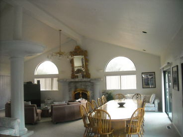 The great room features dining for 16, grand piano, Wi-Fi and more.