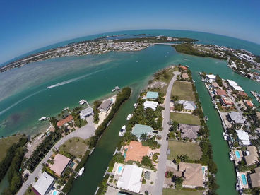 Canal on the left, midway down on right w/orange roof