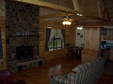 Large Living Room with high vaulted ceilings and natural river stone fireplace.