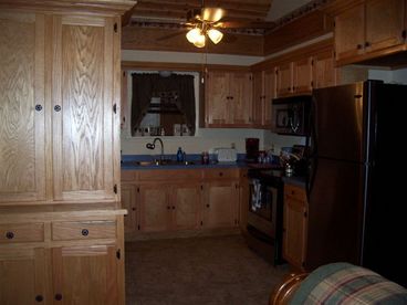 Custom Built Red Oak Cabinets with large kitchen appliances.