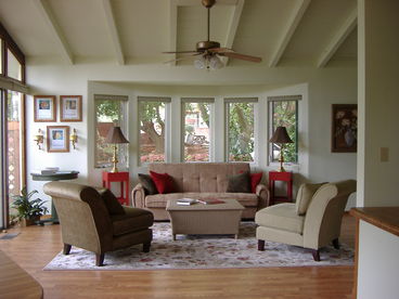 Spacious livingroom opens to patio area.   Windows all around provide garden and redrock views.  