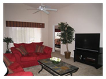 Open concept living.  Living Room and Dining Room combination; sliding patio doors to pool, living room with large tv.