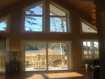 14 foot ceilings with windows from floor to ceiling make this a large, cozy entertaining room, complete with leather furniture and spectacular views of Red Lake.