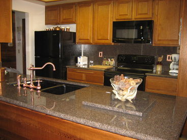 The Kitchen has been recently remodeled, with granite countertops and new appliances, including a wine cooler.