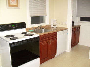 Kitchen showing: stove, counter top, dishwasher, garbage disposal, also has microwave, coffee maker, plenty to pantry space.  Just bring food & drinks