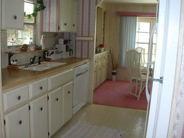 Fully equipped kitchen; includes dishwasher, microwave, icemaker, utensils, pots, pans, slow cooker, George grill, juicer, etc.