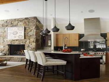 This bar separates the Kitchen from the Living Room.  In the background you will notice a floor-to-ceiling, stone fireplace.