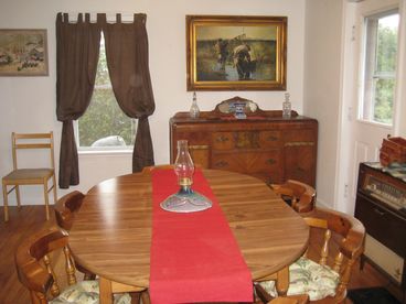 Hard wood floors, genuine maple wood antiques make this a lovely room to enjoy a meal and conversation.  Lots of windows overlooking the back garden and deck. 