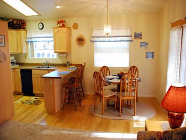 Seats 4 comfortably, with a beautiful view through the window of nearby mountains. Door continently located leading to outer deck area for relaxing in the fresh mountain air.
