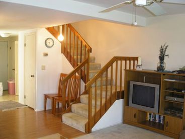 Entertainment center with TV and cable.
Stairway to second level.