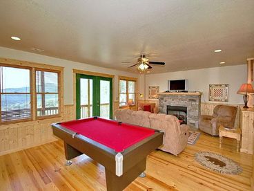 Shoot some pool or enjoy the game on the Flat Screen as you relax by the fire!
