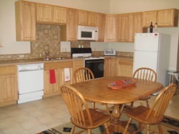 Kitchen includes fridge/freezer, stove, oven, microwave, toaster, coffee maker, and all new kitchenware and utensils.