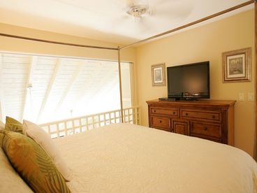 Upstairs master bedroom with Tommy Bahama canopy bed with king luxury pillowtop mattress
