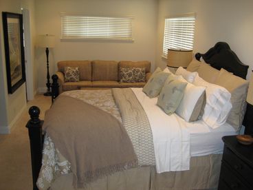 Relax in your master retreat with sitting area, large walk in closet and flat screen TV.