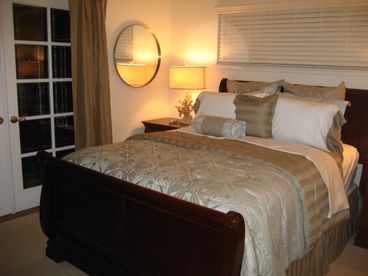 Guest bedroom with french doors out to enclosed hot tub. Also TV/DVD player.