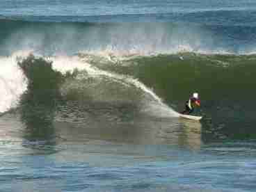 Surfing in front of the cottages