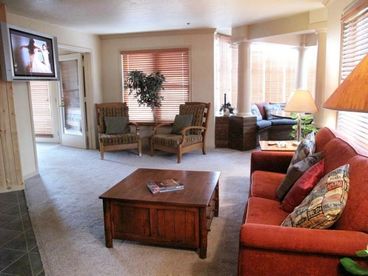 Large spacious living area with a large flat screen TV