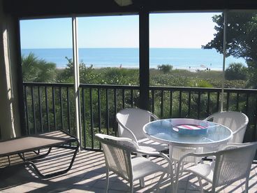 Screened Lanai with direct oceanfront view and new patio furniture