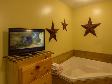 Fireplace and Corner Jacuzzi Tub in 1st Master Bedroom. 