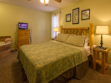 Master Bedroom with King Size Log Bed, Cable TV, Connecting Bath in Gatlinburg Cabin